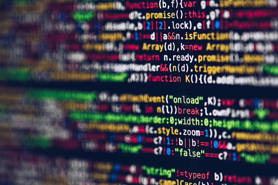 A close-up photograph of a computer screen displaying lines of HTML code with various tags, attributes, and hyperlinks in different colors such as yellow, blue, red, and green. The code appears to inc